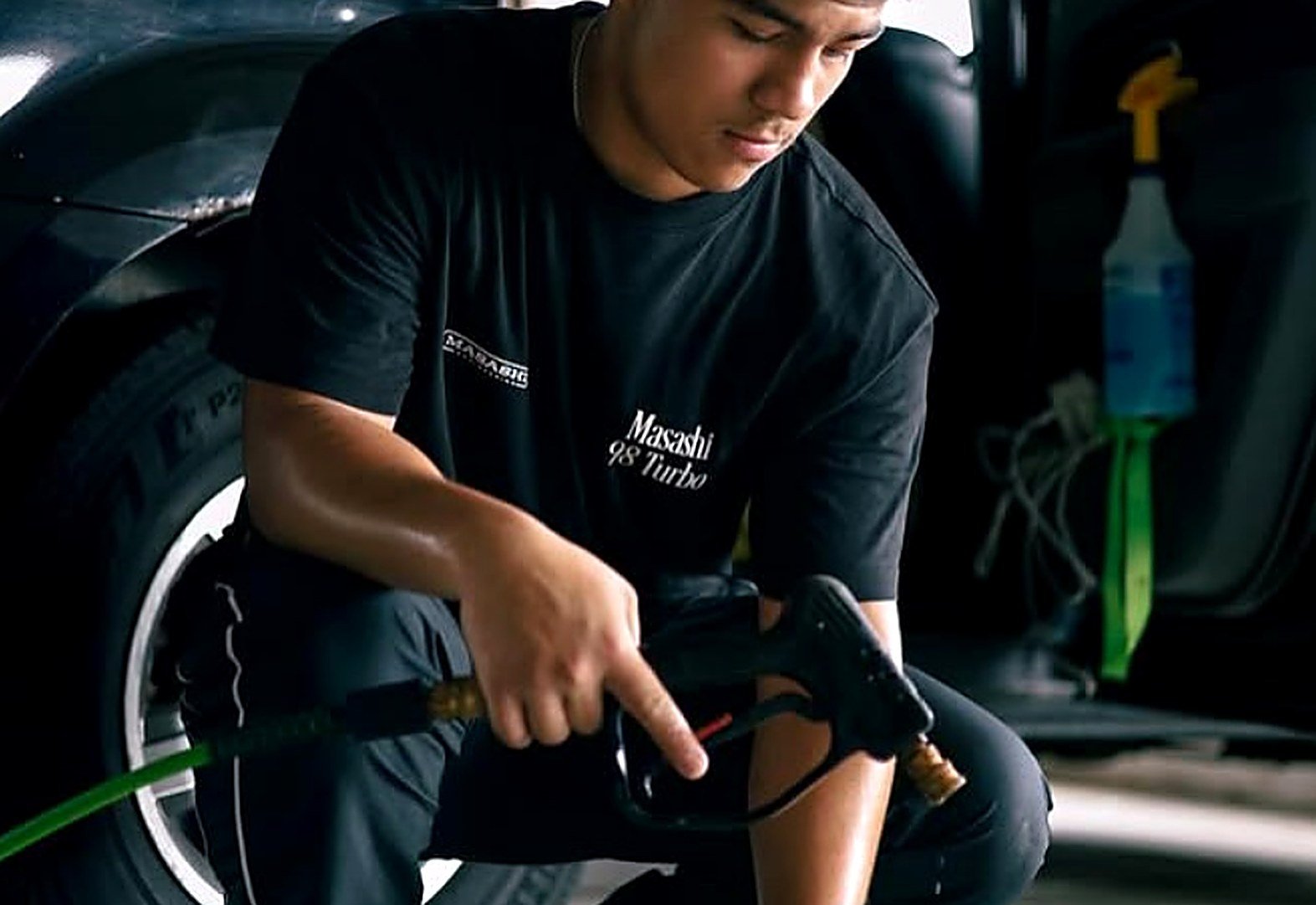 Rich Detailing at work — pressure washing a wheel